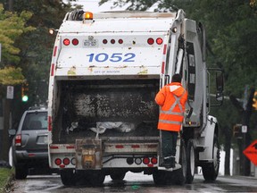 A Windsor garbage truck picks up residential waste Wednesday Sept. 7, 2011, on Aylmer Ave. in Windsor, Ont. (Dan Janisse/The Windsor Star)