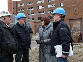 Lee Anne Doyle, second right, chief building official for the City of Windsor, Rob Vani, behind left, manager of inspections and Jamie Demars, left, property standards officer, were joined by two Ministry of Labour inspectors, who did not release their names, at the former Grace Hospital site Tuesday February 7, 2012. (NICK BRANCACCIO/The Windsor Star)