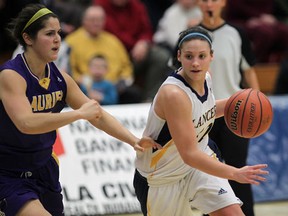 Windsor's Jocelyn LaRocque (R) drives around Laurier's Alena Luciani during their game Wednesday, Feb. 1, 2012, in Windsor, Ont. (Dan Janisse/The Windsor Star)