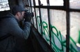Dennis Maitland, a Detroit-based photographer from Romeo, MI, takes photos while exploring the Detroit Harbor Terminal, also known as the Boblo Dock Building, south-east of downtown Detroit, MI, Monday, Feb. 20, 2012. Maitland is having a gallery showing of his work at Phog Lounge in downtown Windsor through the month of February. (DAX MELMER / The Windsor Star)
