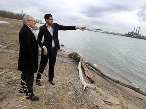 City councillor Al Maghnieh (right) speaks the reporter Daniel Lak from the news network Al-Jazeera on the shore of the Detroit river near the Brighton Beach power plant about the Windsor hum on Tuesday, February 7, 2012. The infamous hum is gaining international attention. (TYLER BROWNBRIDGE / The Windsor Star)