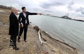 City councillor Al Maghnieh (right) speaks the reporter Daniel Lak from the news network Al-Jazeera on the shore of the Detroit river near the Brighton Beach power plant about the Windsor hum on Tuesday, February 7, 2012. The infamous hum is gaining international attention. (TYLER BROWNBRIDGE / The Windsor Star)
