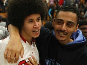 Forster's William Lara-Caston, left, celebrates with his father, Fred Caston after Lara-Caston hit the game-winning shot to defeat Essex 70-69 in the WECSSAA AA senior boys basketball final at the St. Denis Centre, Sunday, Feb. 19, 2012.