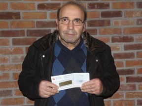 Maidstone resident Giulio Musso holds a Lotto 6/49 cheque worth $79,727.