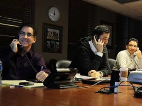 MP Brian Masse, city councillor Al Maghnieh, Gary Grosse and LaSalle Mayor Ken Antaya (left to right) take part in a telephone town hall meeting focusing on the Windsor hum at city hall in Windsor on Thursday, February 23, 2012. (TYLER BROWNBRIDGE / The Windsor Star)