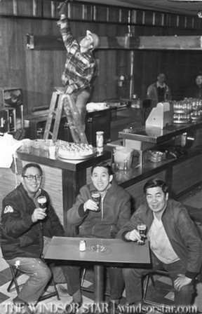 Apr.2/1975-The Lee brothers, left to right, Pete, Jimmy and Ben raise a glass after renovations are made turning Lee's Imperial House into a liquor lounge. (The Windsor Star-Jack Dalgleish)
