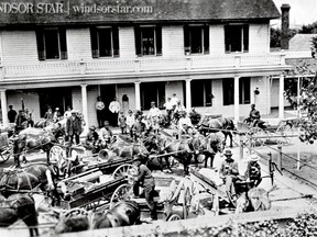 Petite Cote,(Lasalle) Ont. 1912-Empty wagons and weary faces fill Front St. in Petite Cote as residents enjoy a cold beer at the close of a market day. (The Windsor Star-FILE)