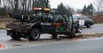 OPP officers investigate at the scene of a fatal motor vehicle accident on highway 3 near Windsor on Tuesday, January 17, 2012. A tow truck driver was changing the tire on a vehicle when he was struck and killed by a passing Mercedes Benz. (Tyler Brownbridge/The Windsor Star)