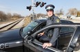 Ontario Provincial Police Const. Blake Cohoe poses Tuesday, Mar. 6, 2012, near the Via Rail tracks on Emery Dr. in Emeryville, Ont. Cohoe blocked the tracks with his cruiser early this morning to alert an oncoming train to a car that was struck on the tracks. (Dan Janisse/The Windsor Star)