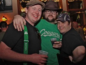 Jon Sparling, left, Chris Galos and Michael McKinnon attend Mick's Irish Pub in downtown Windsor to celebrate St. Patrick's Day Saturday, March 17, 2012.