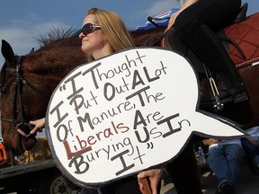 Anita Fritz listens during a protest against the removal of slots from the Windsor Raceway in Windsor on Thursday, March 22, 2012. (TYLER BROWNBRIDGE / The Windsor Star)