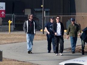 Workers join a picket line at the Aveos facility in Montreal, Quebec, in this Mar. 19, 2012 file photo.