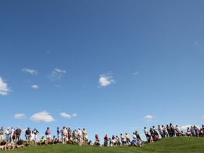 A crowd gathers at the Ambassador Golf Club under a clear sky in this August 2011 file photo.