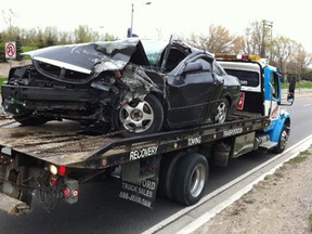 The wreck of a car that crashed in a single vehicle accident on Dougall Avenue in Windsor, Ont. in the early morning hours of Mar. 30, 2012.