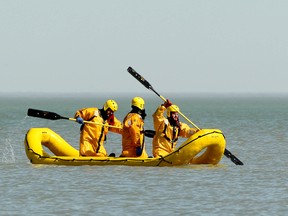 Lakeshore Fire and Rescue volunteers join in marine search efforts for an 18-year-old female boater who went missing after a canoe capsized in Lake St. Clair. Photographed Sunday, March 11, 2012.