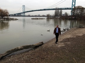 Matthew Child of the Essex Region Conservation Authority walks along the Detriot River shore in this December 2011 file photo.