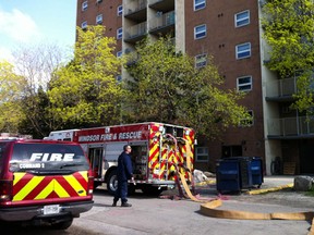 Firefighters at the scene of an apartment building fire on Erskine Street in Windsor, Ont. on Mar. 26, 2012.