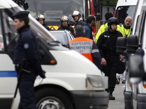 French police surround a residence in Toulouse believed to be the hiding place of a suspect in Monday's shootings at a Jewish school. Photographed March 21, 2012.