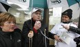 Harness racing legend Bob McIntosh (centre) joins a protest by Windsor Raceway supporters at the Windsor offices of Ontario Finance Minister Dwight Duncan on Mar. 30, 2012.