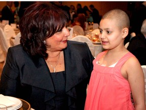 WINDSOR, ONT. MARCH 3, 2012 -- Anita Imperioli, left, takes a moment to talk with nine-year-old Natalie Abdallah at the annual Italian of the Year gala at Caboto Club Sat., March 3, 2012.  Imperioli was recognized with the award for her involvement in the community and specifically for the charity she founded, In Honour of the Ones We Love.  Abdallah, who was diagnosed with cancer five years ago, has received special care from Imperioli's organization. (REBECCA WRIGHT/The Windsor Star)