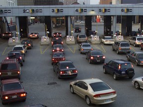 Traffic crawls through the custom booths at the Detroit-Windsor tunnel plaza in this file photo. (Ted Rhodes / The Windsor Star)