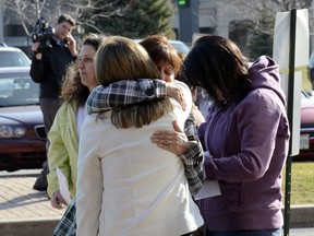 Emotional Windsor Raceway Slots workers gather after being told their jobs will be lost.