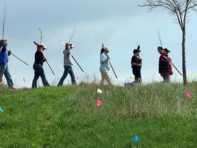 Volunteers prepare to plant trees at an ERCA celebration of Earth Day at Malden Park in Windsor, Ont. in 2006.