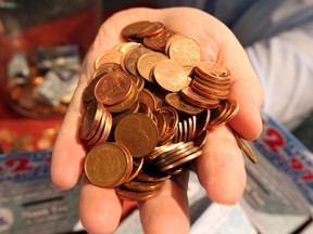 A handful of pennies. (Nick Brancaccio / The Windsor Star)