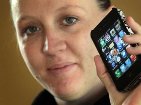 Anne Diamond, 29, shown here in Windsor, Ont. on Thursday, April 12, 2012, is happy that the Ontario government announced it plans to introduce legislation to make cellphone contracts clear and limit the costs of cancelling them.