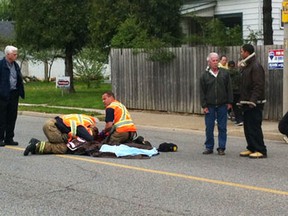 Emergency workers respond to a child struck by a vehicle on Drouillard Road in Windsor, Ont. on April 26, 2012. (Rob Gurdebeke / The Windsor Star)