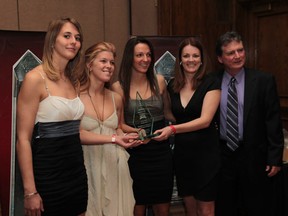 University of Windsor women's basketball coach Chantal Vallee, second from right, and assistant coach Tom Foster, stand with Lancers Jessica Clemencon, Emily Abbot and Bojana Kovacevic after the 2011-12 Lancer Women's basketball team was named the 2012 WESPY Awards team of the year at the Caboto Club on April 19, 2012 in Windsor, Ontario. (Jason Kryk/The Windsor Star)