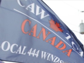 The flag of CAW Local 444 is seen at a rally in this January 2012 file photo. (Jason Kryk / The Windsor Star)