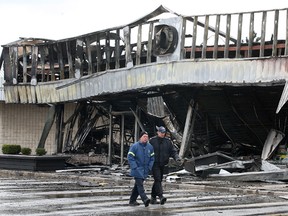 Investigators check out the aftermath of the fire at 6711 Tecumseh Rd. East in Windsor, Ont. Photographed April 10, 2012. (Dan Janisse / The Windsor Star)