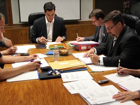 The Windsor Public Library board is seen in this June 2011 file photo. City councillor Al Maghnieh is at the head of the table. Maghnieh has since resigned his position as chair of the board due to his misue of a library-issued credit card. (Nick Brancaccio / The Windsor Star)