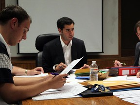 WINSOR, ONT. JUNE 29, 2011 --  Library board members Denny Timm, left, Hilary Payne, behind, Al Maghnieh, library CEO Barry Holmes, board member Alex Cameron work through the library board agenda at the Central Branch Wednesday June 29, 2011. (NICK BRANCACCIO/The Windsor Star)