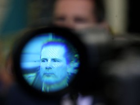 Premier Dalton McGuinty tours the Omega Tool Corp. plant Tuesday, April 10, 2012, in Tecumseh, Ont. He is seen through the viewfinder of a video camera. (DAN JANISSE/The Windsor Star)