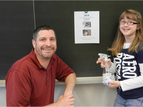 Our Lady of Mount Carmel School's Grade 4 Teacher, Brian Angus, and student/creator of Zap M, Madison Balkwill.