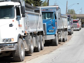 WINDSOR, ONTARIO - APRIL 27, 2012 -Dump trucks remained idle for period of time at the scene of  a labour dispute at the Windsor-Essex Parkway construction site on Matchette Road in Windsor, Ontario on April 27, 2012.   (JASON KRYK/ The Windsor Star)