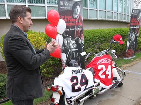 Former NHL'er Sheldon Kennedy applauds in tribute to his teammate, the late Bob Probert. Kennedy has been named leader of the 2012 Bob Probert Memorial Ride. Photographed April 3, 2012 at Hotel-Dieu Grace Hospital. (Dan Janisse / The Windsor Star)