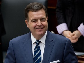 TORONTO, ONTARIO: MARCH 27, 2012 - Ontario Finance Minister Dwight Duncan smiles as he delivers the 2012 Ontario budget in the Ontario legislature in Toronto, Ontario,  Tuesday, March 27, 2012.   (Tyler Anderson/National Post)