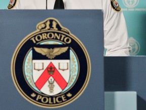 The logo of Toronto Police is seen at a press conference in this 2011 file photo. (Aaron Lynett / The National Post)