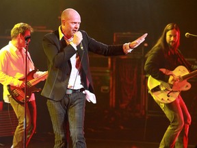 Iconic Canadian rock band The Tragically Hip perform in Ottawa in this 2009 file photo. From left: Gord Sinclair, Gord Downie, and Rob Baker. (John Major / The Ottawa Citizen)