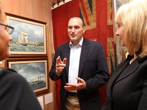 Files: Essex MP Jeff Watson, left, discusses the War of 1812 bicentennial at the Windsor Community Museum on April 16, 2012. (Dan Janisse / The Windsor Star)