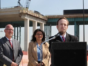 From left, Kirk Steudle, director at the Michigan Department of Transportation, Rashida Tlaib, State Representative for Detroit, and Lt. Governor Brian Calley, attend a press conference announcing a new access road for trucks exiting the Ambassador Bridge, Tuesday, May 15, 2012. (DAX MELMER/The Windsor Star)