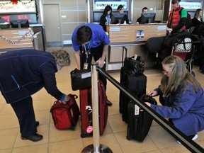 Travelers are seen in this file photo. (Walter Tychnowicz/Edmonton Journal)