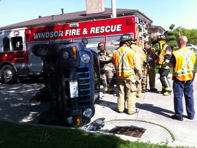 A vehicle flipped on its side at the intersection of Askin Boulevard and Algonquin Street in Windsor on May 14, 2012. (Jay Kryk/The Windsor Star)