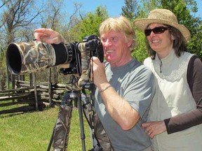 Novice birders Raymond Charbonneau and Francine Desmarais are among the growing flock of Quebec visitors to Point Pelee. Leamington businesses that thrive on birding tourists say Quebecers are making up for the loss of American tourists due to the tightening of the border and the high Canadian dollar. (Sarah Sacheli/The Windsor Star)