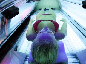 A woman lies on a tanning bed in this file photo. (Robert Gauthier/Los Angeles Times/MCT)