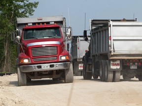 Truck drivers transport earth removed during the Windsor-Essex Parkway construction near Matchette Road and E.C. Row on May 25, 2012 in Windsor, Ontario. (Jason Kryk)