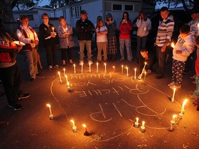 Friends and family hold a candle light vigil in front of the home of Richard Lemmon in Windsor on Wednesday, May 16, 2012. Lemmon was found dead at his residence on Tuesday Morning. (TYLER BROWNBRIDGE / The Windsor Star)
